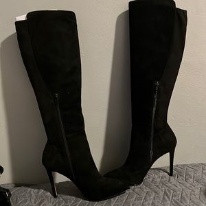 Black knee high heeled boots